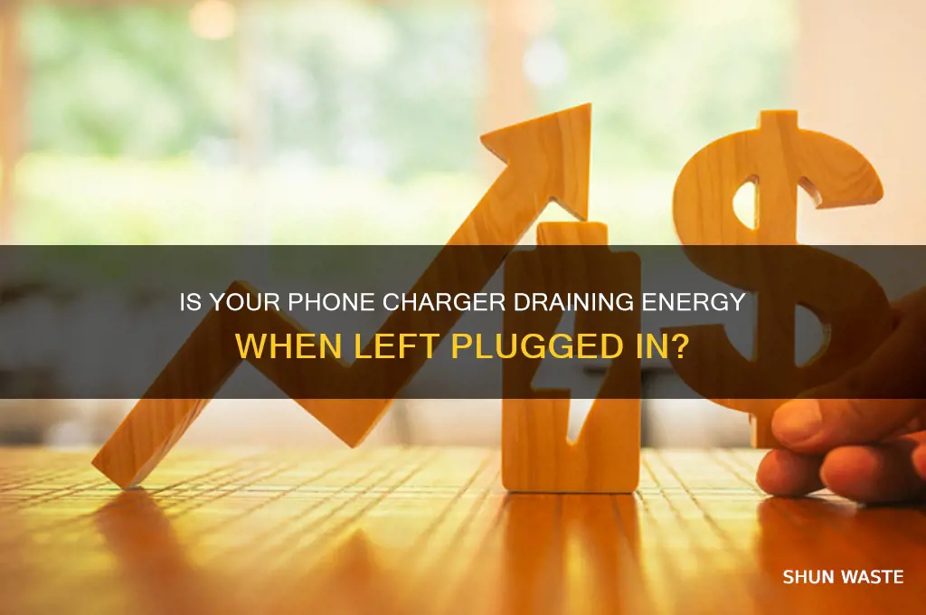 does having a phone charger plugged in waste electricity