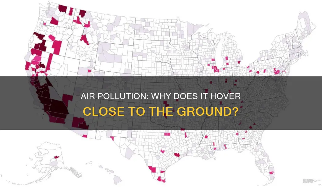 why does air pollution stay close to the ground